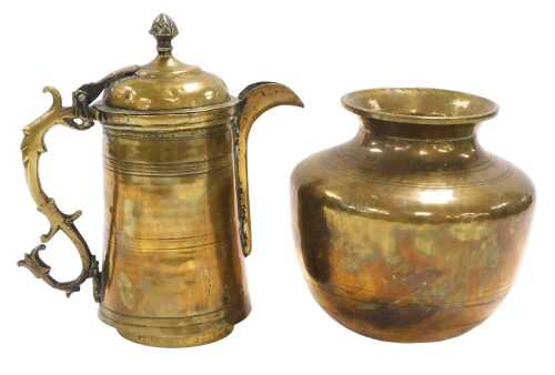 A late 19thC Turkish brass coffee pot, with a hinged lid and S scroll handle, 21cm high,...