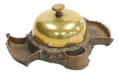 A late 19thC cast copper and brass hotel desk bell and match strike, stamped to underside Russel...
