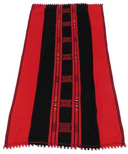 An Angami Kisema red and black woollen blanket, from Nagaland, with geometric motifs, and with a...