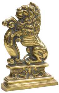 A late 19th/early 20thC cast brass doorstop, modelled in the form of a standing heraldic lion,...