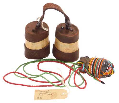 A Himba pair of fat and ochre pots, made from horn, leather and interconnected metal beads, and...