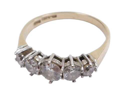A 15ct gold and cz five stone ring, in a graduated claw setting, size Q&frac12;, 2.7g.