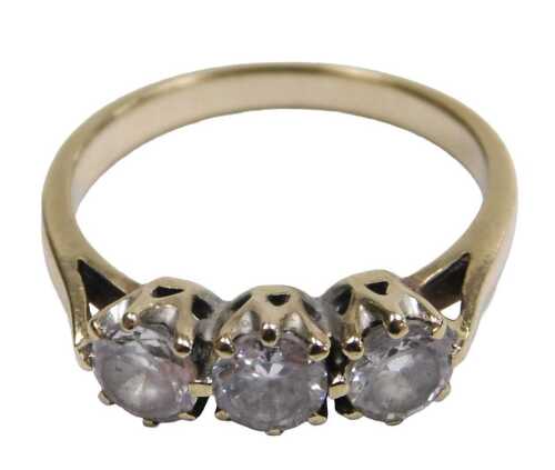 A 9ct two colour gold and diamond solitaire ring, in a high claw illusion setting, with engraved...