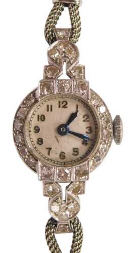 An Art Deco lady's diamond set cocktail watch, circular silvered dial bearing Arabic numerals,...