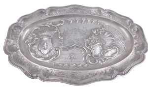 A Continental pewter meat dish or charger, cast with a crest, scrolls, flowers, etc., around a...
