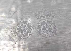 A Continental pewter meat dish or charger, cast with a crest, scrolls, flowers, etc., around a... - 2