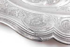 A Continental pewter meat dish or charger, cast with a crest, scrolls, flowers, etc., around a... - 3