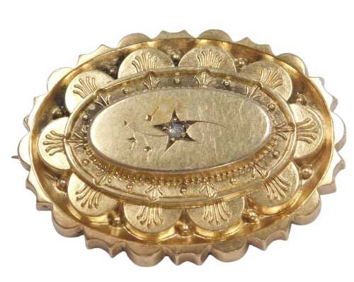 A Victorian Etruscan style diamond set oval brooch, in yellow metal.