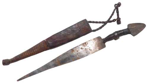 An African Tuareg Sheru dagger, with a cast iron pommel, leather bound hilt, and steel blade, in...