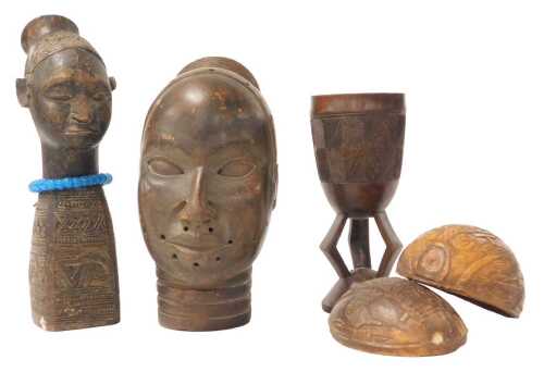 A Nigerian Benin terracotta female bust, 20cm high, a Benin carved coconut box, 12cm high, an...