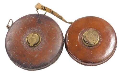 A Chesterman leather bound 100ft tape measure, together with a Dacres Rabjohns Ltd 66ft tape...