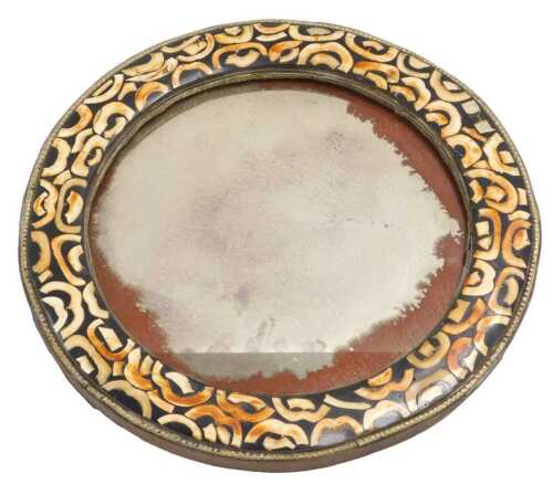 A 20thC North African circular mirror, inlaid with camel's tooth, 36cm wide.