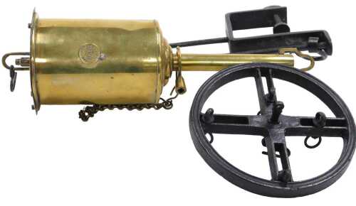 A 19thC brass Salter's Economical spitjack, with key, suspension rack, etc., 31cm long.