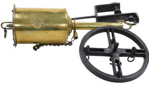 A 19thC brass Salter's Economical spitjack, with key, suspension rack, etc., 31cm long.