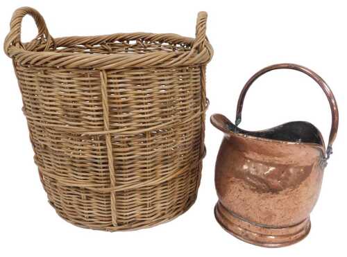 A wicker log basket, of twin handled cylindrical form, 42cm high, 48cm wide, together with a...