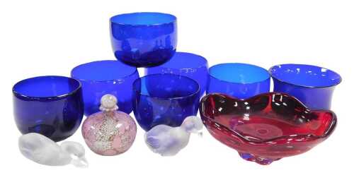 Six Bristol blue glass finger bowls, together with a mottled pink and white scent bottle and...