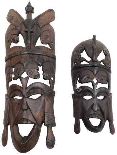 Two Kenyan Songye masks, carved with seated figures and stylised figural heads, 45cm high and...