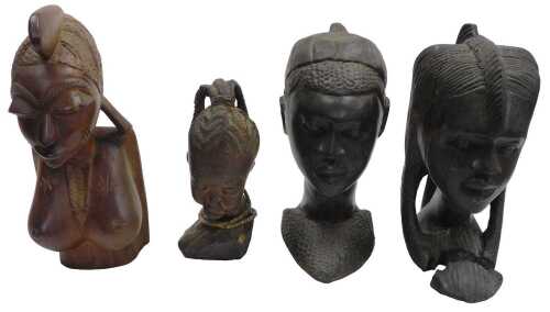 Two African tribal busts, carved as a boy and girl, 30cm high, and two further busts. (4)
