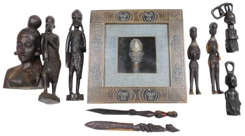 An African tribal mask, framed and glazed, further African carved figures, a bust, etc. (a...