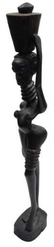 An African carved wooden figure of a woman carrying a vessel on her head, of elongated form,...