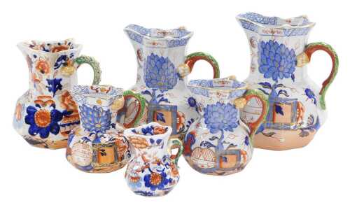 Four 19thC Masons ironstone graduated hydra jugs, Imari decorated with a chinoiserie garden, and...