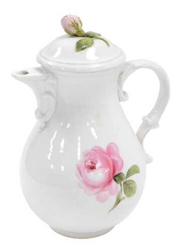 A 20thC Meissen porcelain coffee pot, painted with roses, blue crossed swords mark, 24cm high.