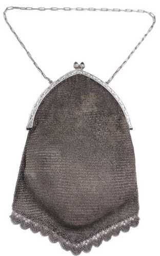 A silver chain mail evening bag, the clasp engraved with scrolling leaves, with a sapphire blue...