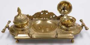 A Continental brass ink stand, with two hinged wells and pen receptacle, 28cm wide, a brass... - 2