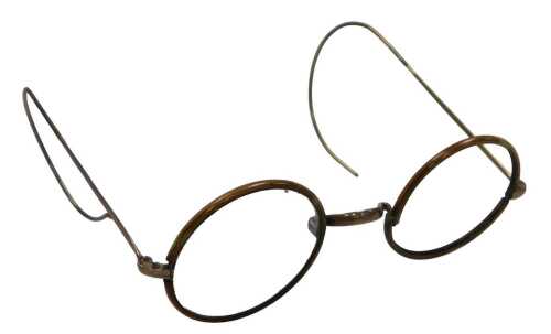 A pair of mid century circular tortoiseshell spectacles, with a rose metal bridge, stamped 9ct,...