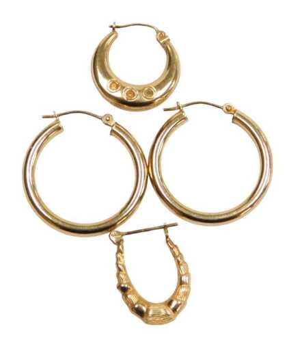 A pair of plain hoop earrings, yellow metal, stamped 375, and two gypsy earrings, 2.8g.