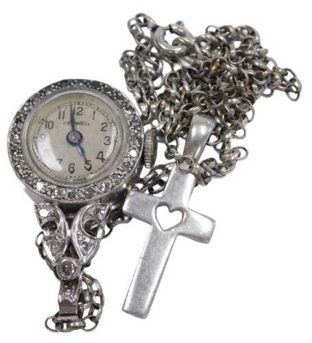 A mid century Kenwell diamond set lady's pendant watch, circular cream dial bearing Arabic...