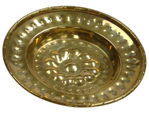 A late 18th/early 19thC small brass charger or alms plate, embossed and pierced with a...