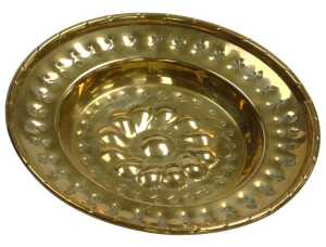 A late 18th/early 19thC small brass charger or alms plate, embossed and pierced with a...