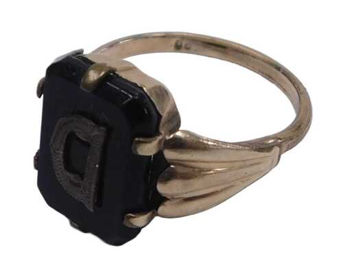A black onyx signet ring, the rectangular table with a raised letter D, in yellow metal, bears...
