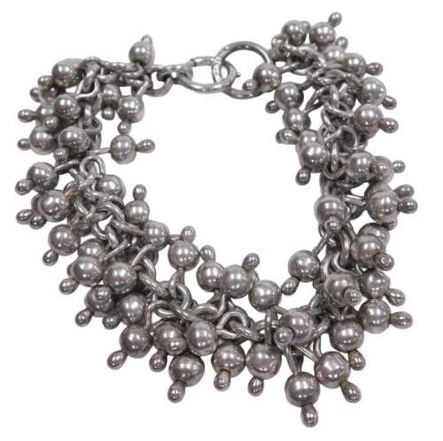 A Nepalese fringe bracelet, on a bolt ring clasp, stamped 925, 2.29oz.