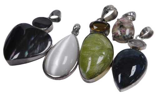 Five silver and agate set pendants.