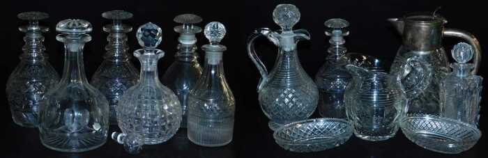 A quantity of cut glass, to include a pair of decanters and stoppers, a water jug with silver...
