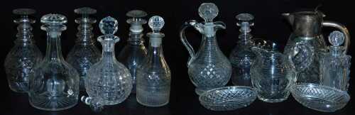 A quantity of cut glass, to include a pair of decanters and stoppers, a water jug with silver...