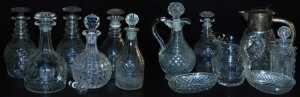 A quantity of cut glass, to include a pair of decanters and stoppers, a water jug with silver...
