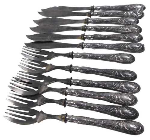 A set of twelve 19thC Continental fish knives and forks, the handles embossed with flowers with...