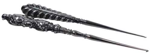 An Edward VII silver handled crochet hook, Birmingham 1903, and a Victorian crochet hook,...