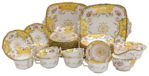A late 19thC Coalport porcelain tea service, decorated with reserves of flowers, on a canary...