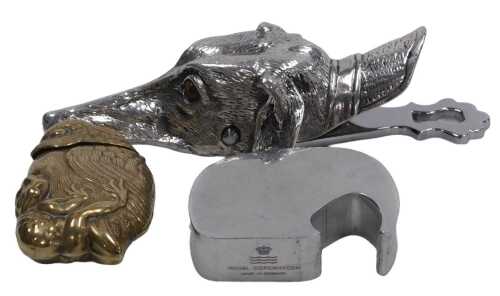 A silver plated paperclip, modelled as the head of a greyhound, with inset glass eyes, 14cm wide,...
