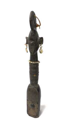 A Nigerian Mumuye style yoke or shoulder mask, embellished with shells, 59.5cm high.