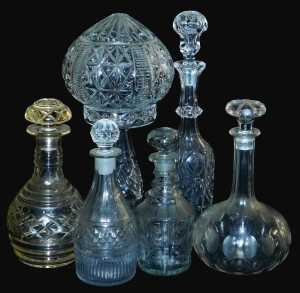 Five 19thC and later decanters and stoppers, and a cut glass table lamp, lacking fittings, 38cm...