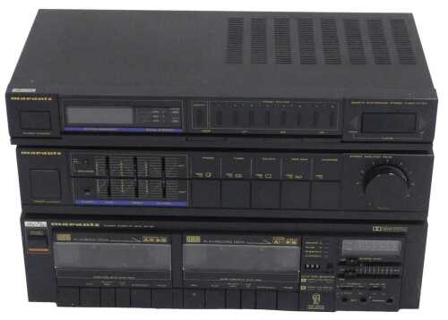 A Marantz hi-fi system, comprising a stereo cassette deck, ST155, an amplifier, PM151, and a...