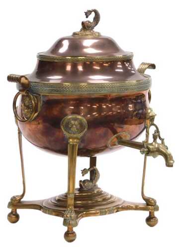 A Regency copper and brass samovar, the domed lid decorated with a dolphin flanked by scrolling...