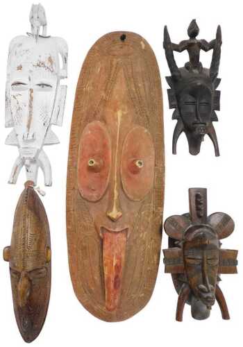A Papua New Guinea Sepik mask, 72cm high, another smaller, together with Senufo Kpelie, etc. (5)