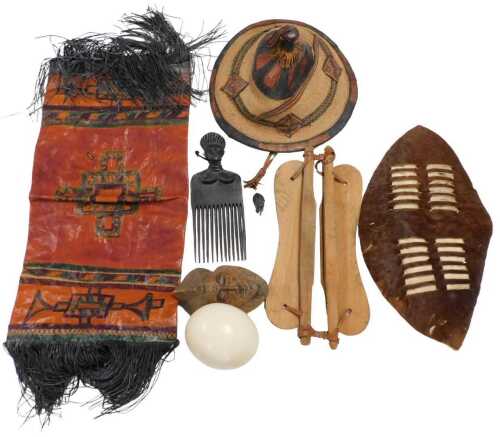 A Zulu hide bound shield, figural hair comb, an ostrich egg, Nigerian Fulani straw hat, etc. (a...