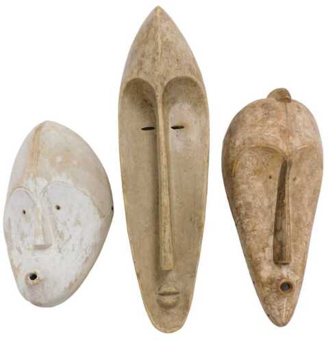 Three Gabon Fang Ngil masks, one coated in kaolin, 35cm, 46cm and 56cm high.